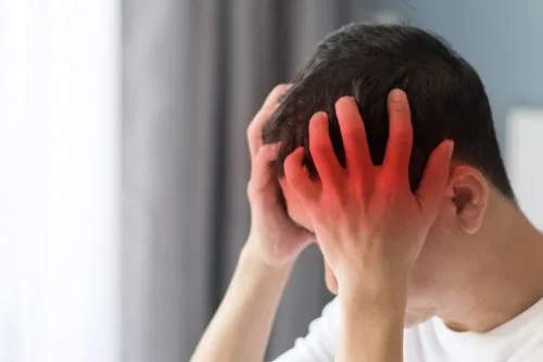 Person with painful headache due to concussion